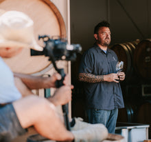 Kristopher Parker stands in the barrel room at Fess Parker Winery